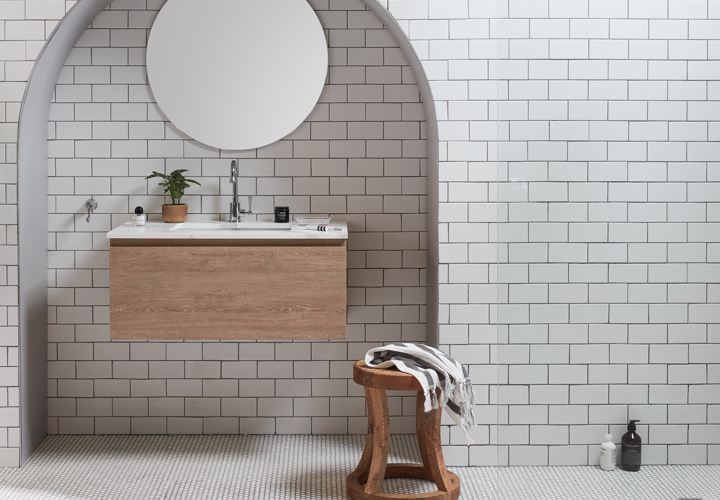 Image of a bathroom displaying Canterbury fittings and products: a sink, a stool, wall tiles and more.